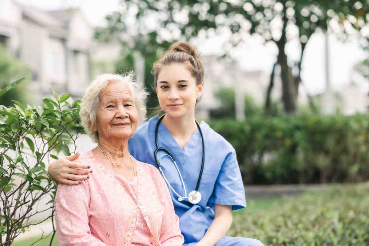 Image shows care assitant gives the love and care to the patient