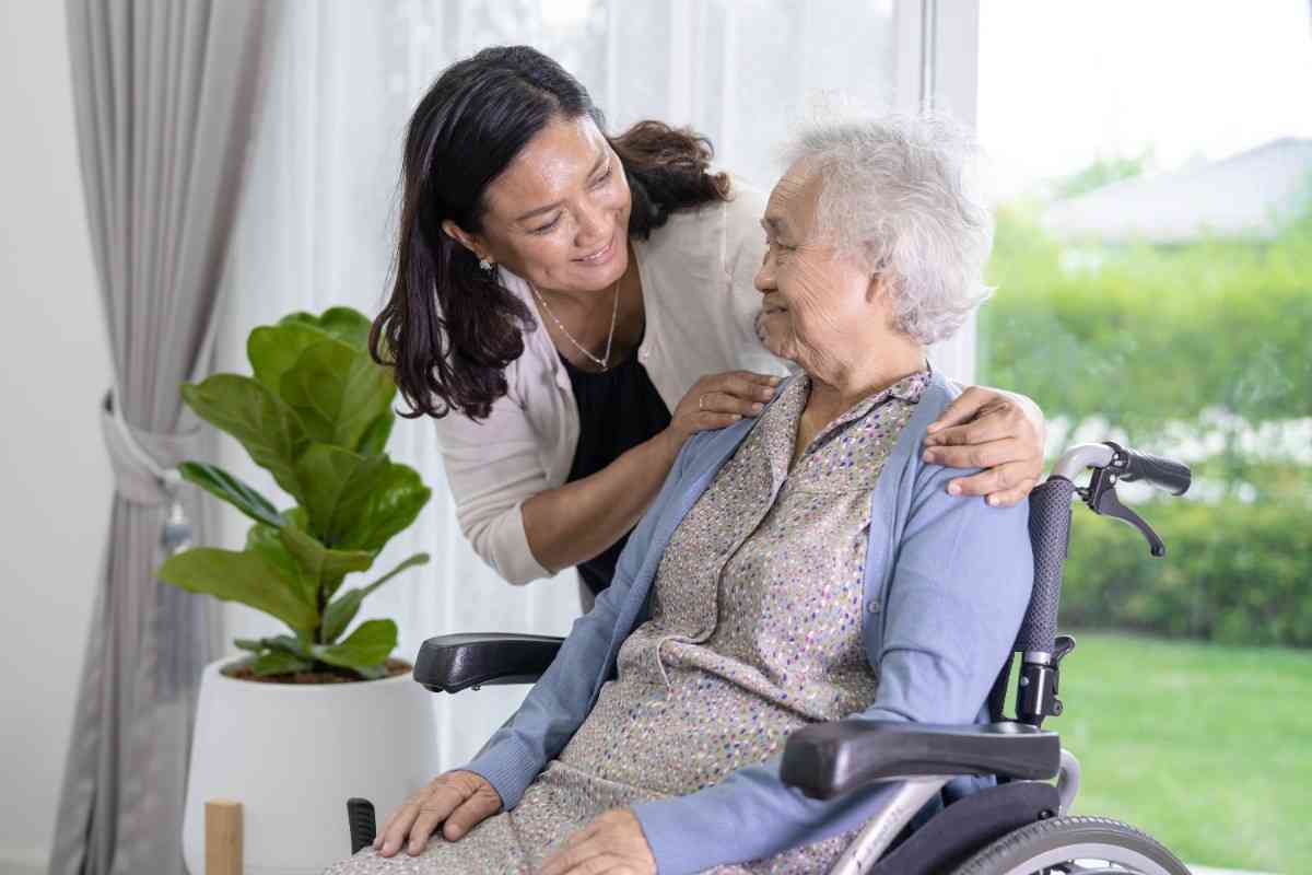 Image shows care assitant gives the love and care to the patient